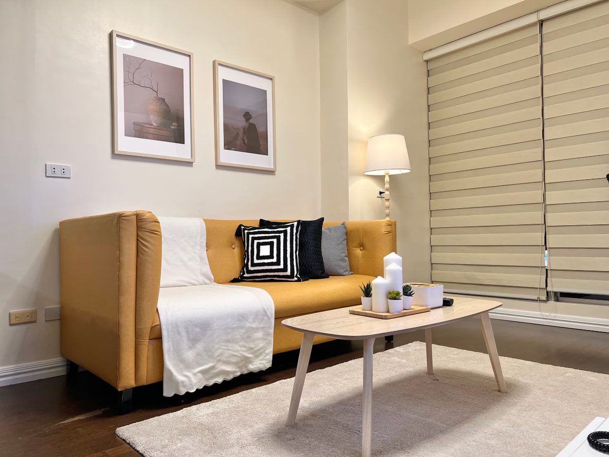 Condo living room with orange sofa