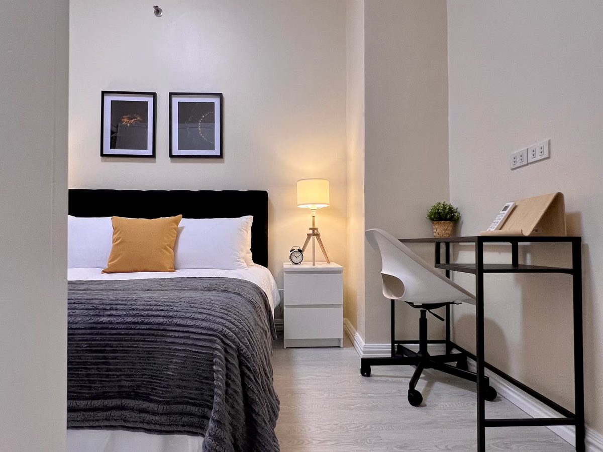 Condo bedroom with twin nightstands